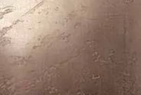 Textured bronze liquid metal sample